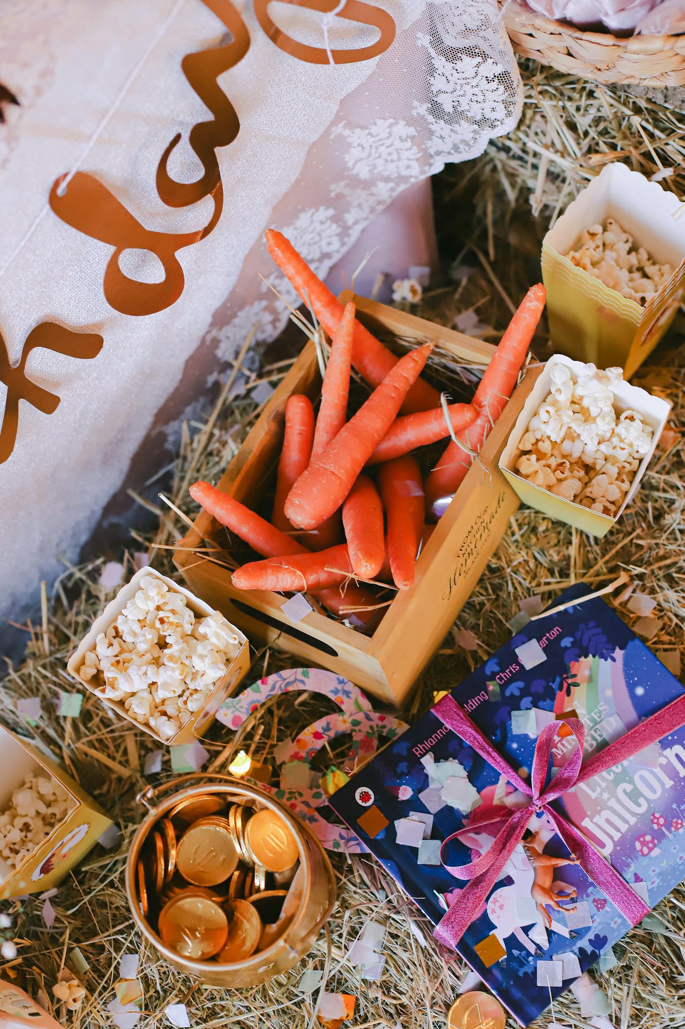 A creative birthday party table setup with carrots, popcorn, and gifts in Istanbul, Turkey.