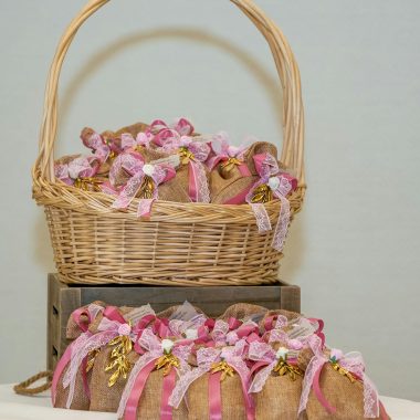 Beautifully arranged gift baskets adorned with pink ribbons, perfect for special occasions.